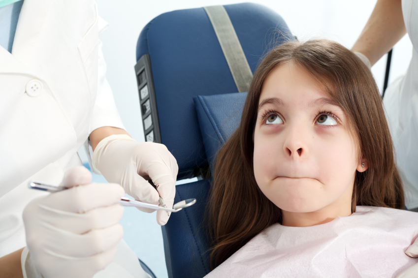 stock-photo-9106227-girl-refusing-to-open-mouth-for-dentist
